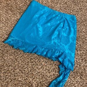 It's a stunning blue skirt with a long blue tail.Rose pattern look lovely on it.